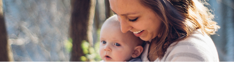 Mother sitting with baby